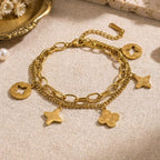 Gold Openwork Four-Leaf Clover Tassel Bracelet — Titanium Steel, 18K Gold, Light Luxury